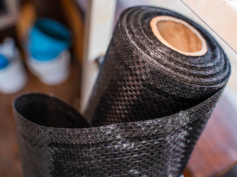 Roll of black reinforced agrofibre close-up