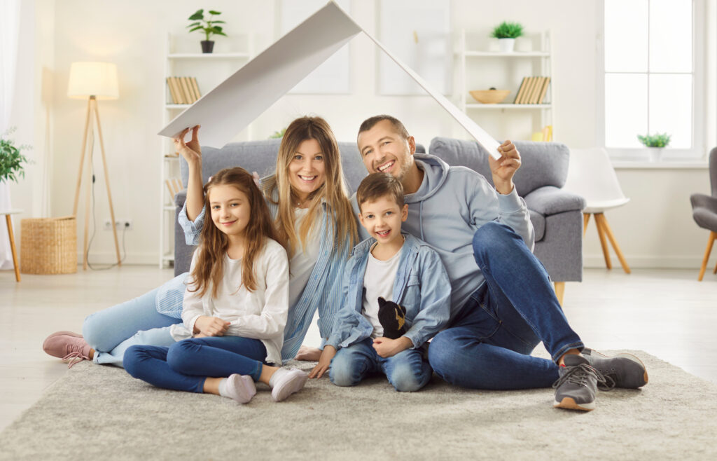 happy family making a fun roof over their head