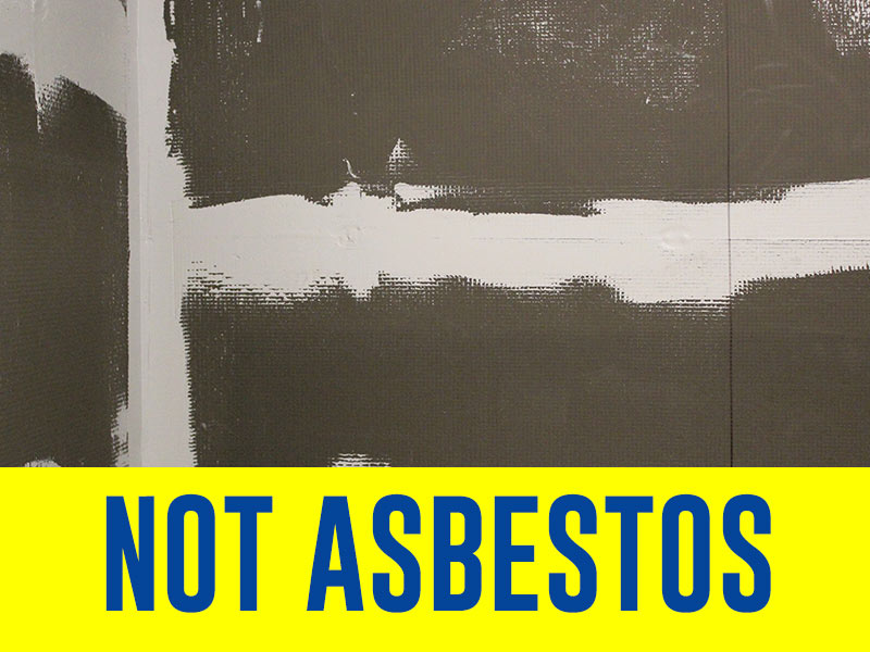 Backer boards install before laying tiles in a bathroom (not asbestos graphic)