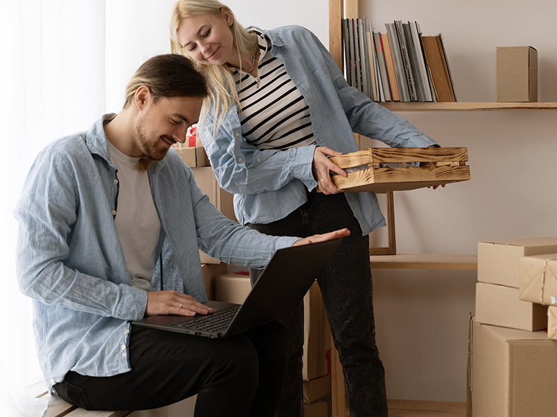 married couple unpacking valuables after flood restoration