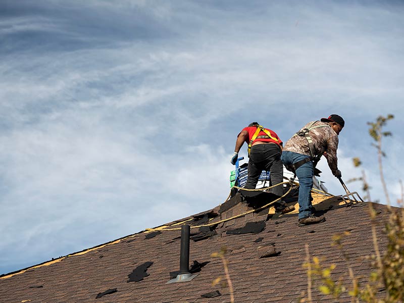Reroofing house after hail storm