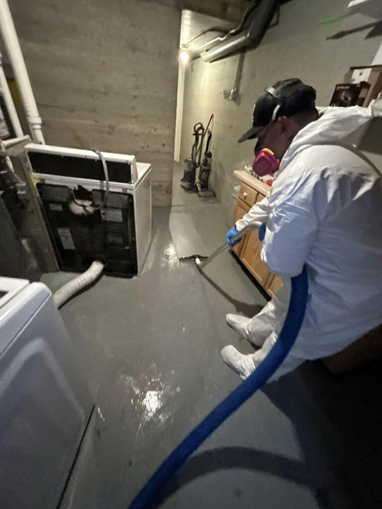 worker using water extraction machine