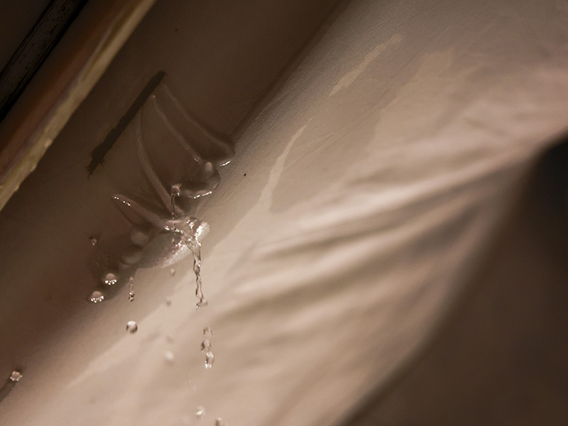 Serious water leak from burst plumbing pipe causing property damage inside home. T