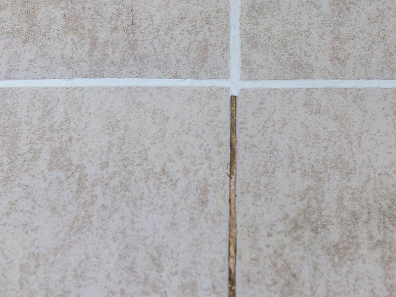 tile grout eroding turning brown