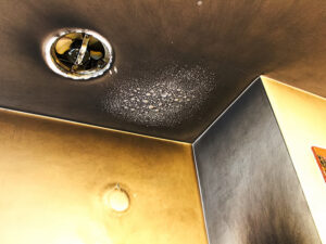 Bubbled and smoked up ceiling with soot after a kitchen fire