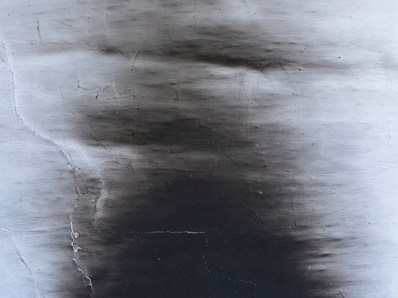 White oven wall in black soot