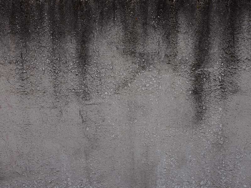 gray black stone background of soot on the old concrete wall