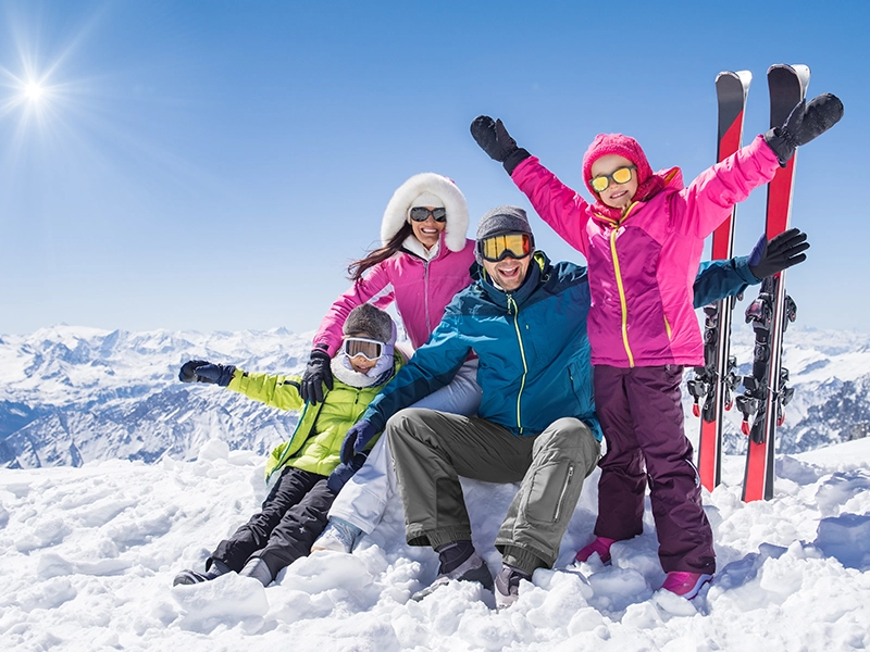Happy family in winter holiday